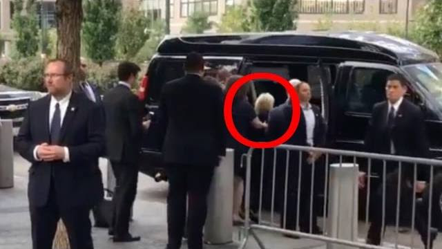 hillary-shoved-into-van-face-down